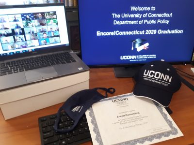 "Welcome to the University of Connecticut Department of Public Policy Encore!Connecticut 2020 Graduation" on a computer screen, a zoom celebration, Encore!Connecticut certificate and hat, DPP mask