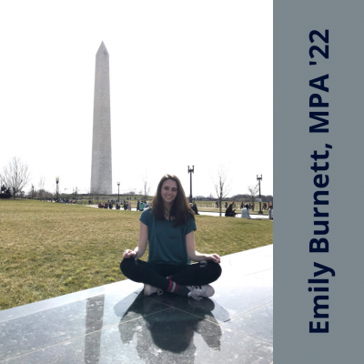 Emily Burnett, MPA '22, sitting in front of the Washington Monument