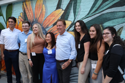UConn School of Public Policy alumni posing with Governor Lamont.