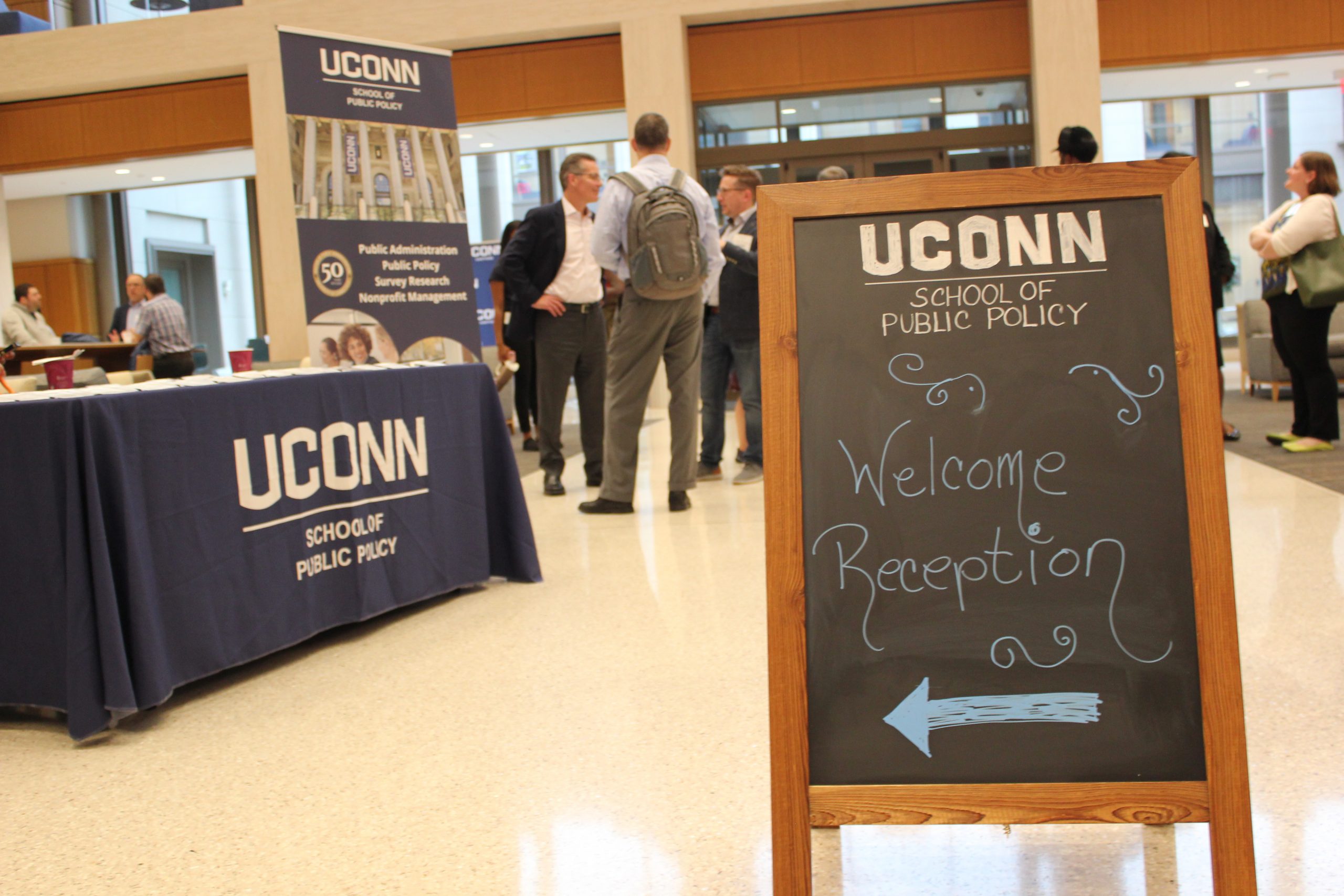 A welcome sign and registration table at SPP's welcome reception